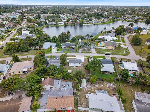 drone / aerial view with a residential view and a water view