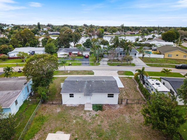 birds eye view of property with a water view and a residential view