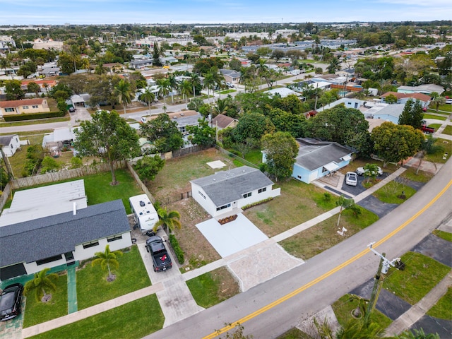 birds eye view of property with a residential view