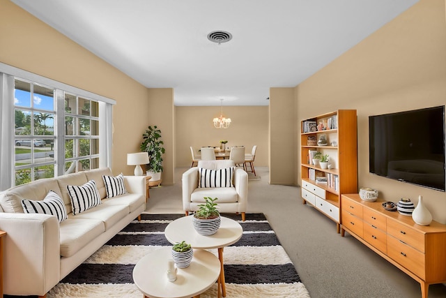 carpeted living area with an inviting chandelier and visible vents