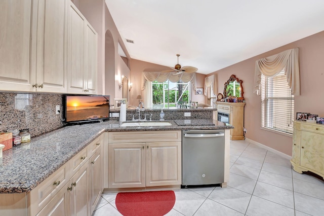 kitchen with a peninsula, a sink, visible vents, stainless steel dishwasher, and decorative backsplash