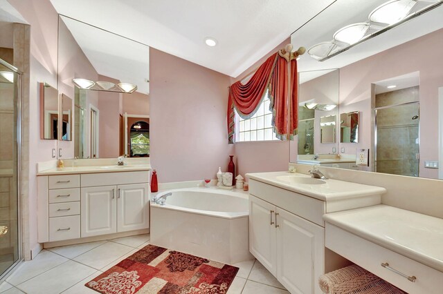 bedroom with ceiling fan, vaulted ceiling, baseboards, and light tile patterned floors