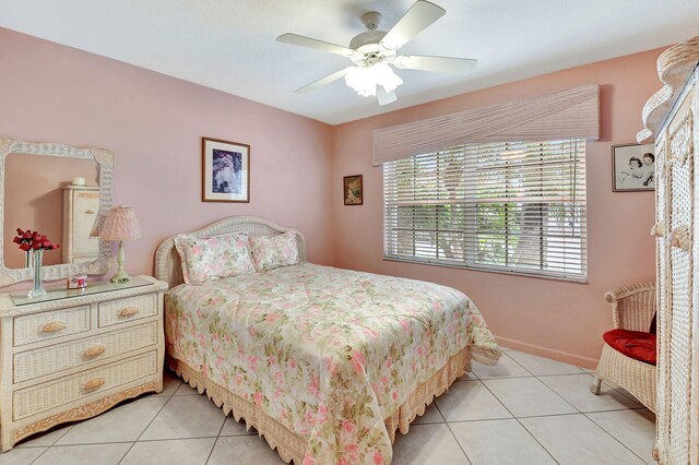 full bathroom with baseboards, vanity, a bath, and tile patterned floors