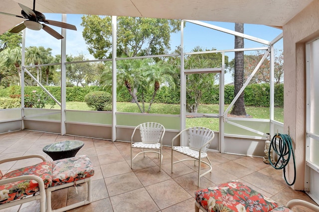 sunroom / solarium with a ceiling fan