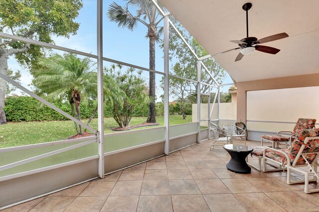 sunroom / solarium featuring ceiling fan