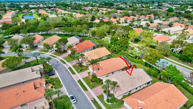 birds eye view of property with a residential view