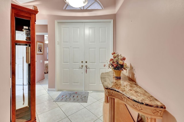 entrance foyer with light tile patterned floors