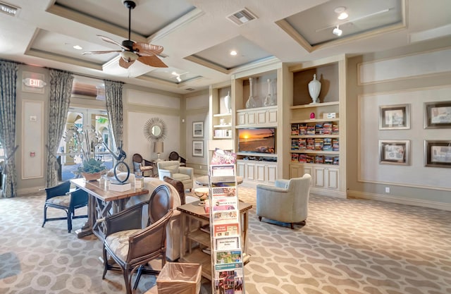 living area with a ceiling fan, visible vents, coffered ceiling, and built in features