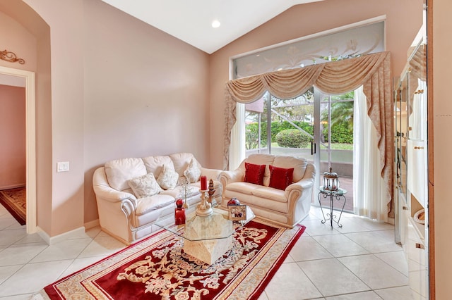 living area with lofted ceiling, recessed lighting, baseboards, and tile patterned floors