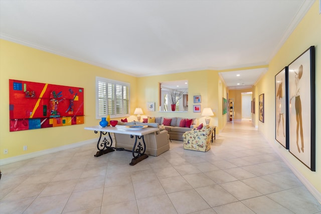 living area with light tile patterned flooring, crown molding, and baseboards