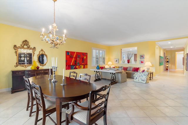 dining area featuring light tile patterned floors, baseboards, ornamental molding, and a chandelier