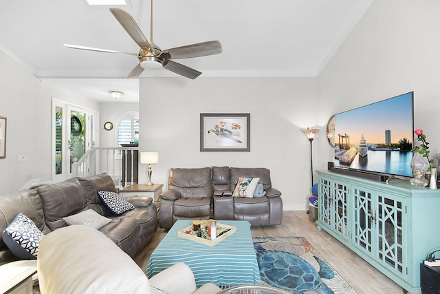 living area with light wood-style floors and ceiling fan