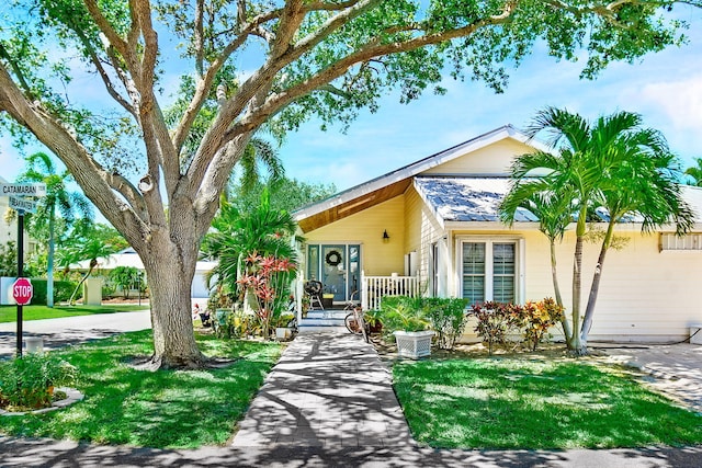 view of front of property with a porch and a front yard