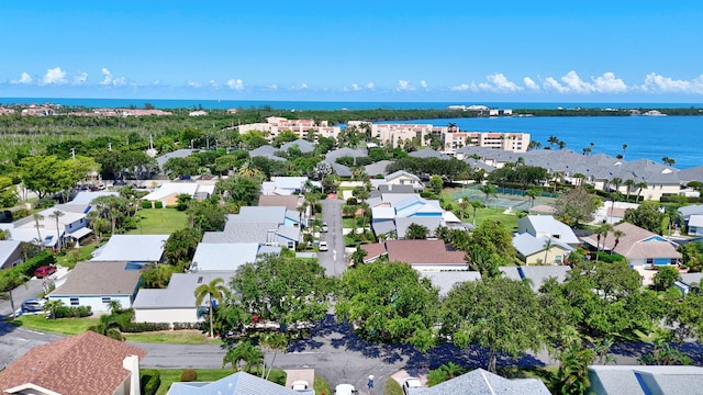 birds eye view of property with a residential view and a water view