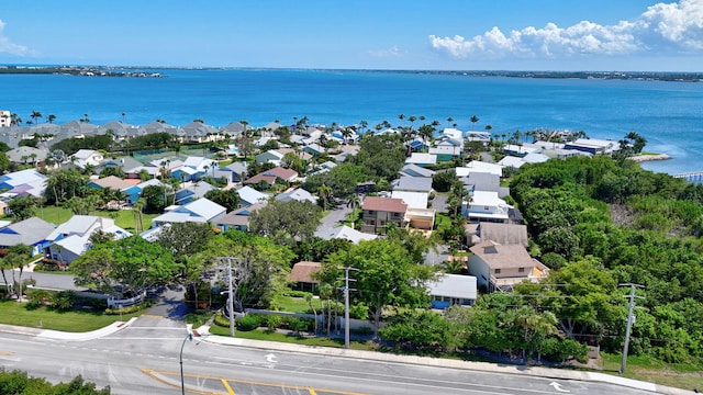 drone / aerial view featuring a water view and a residential view