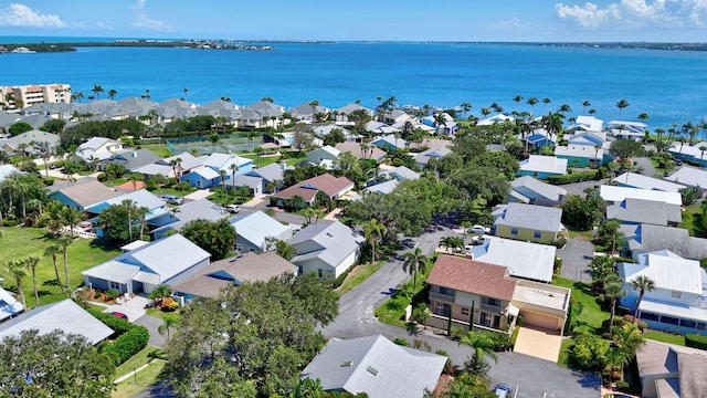 aerial view with a water view and a residential view