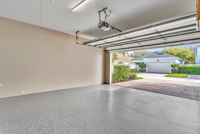 garage featuring a garage door opener