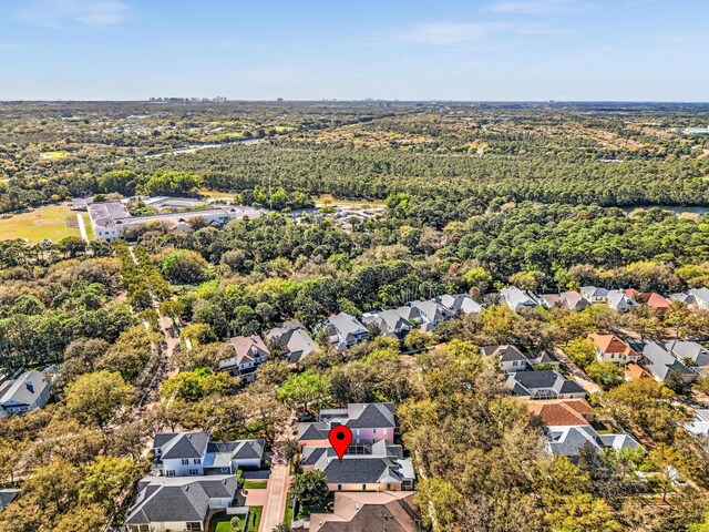 bird's eye view with a forest view and a residential view