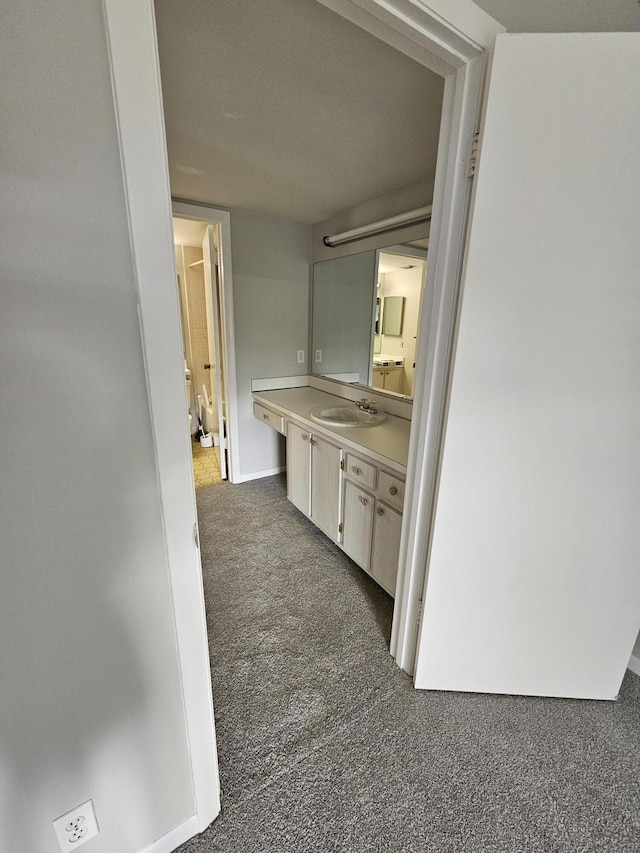 bathroom with baseboards and vanity