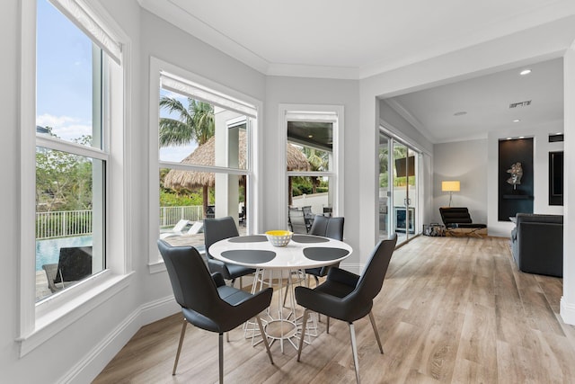 sunroom with a healthy amount of sunlight and visible vents