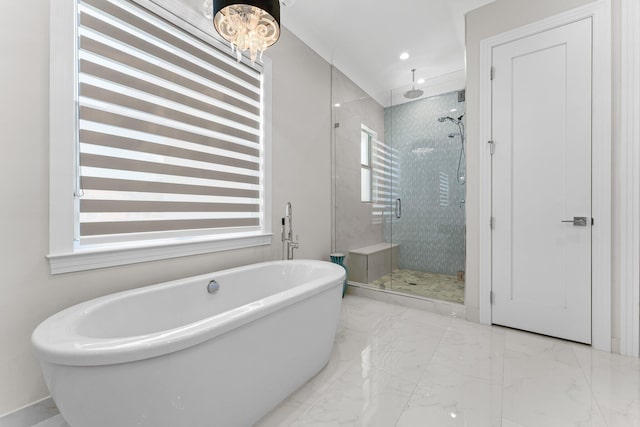 bathroom with a freestanding tub, recessed lighting, marble finish floor, and a stall shower