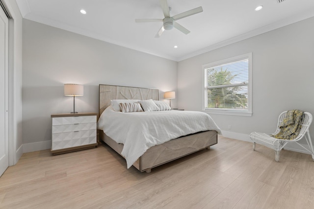 bedroom with baseboards, light wood-style flooring, and ornamental molding