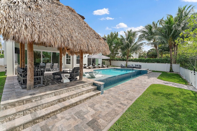 view of pool with a patio, a fenced in pool, a fenced backyard, a gazebo, and a lawn