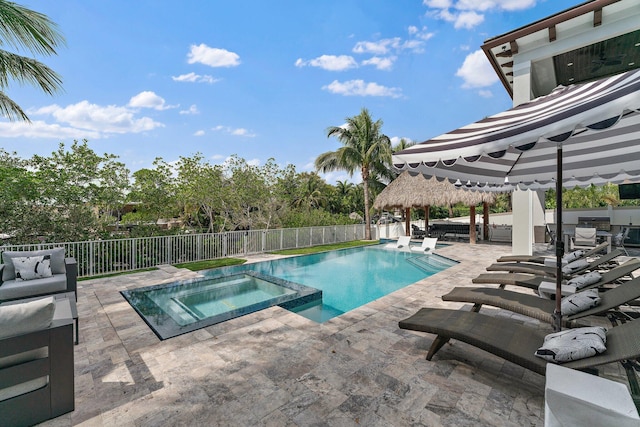 view of swimming pool featuring a gazebo, a patio, a fenced backyard, and a pool with connected hot tub