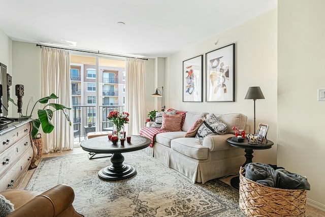 living area featuring floor to ceiling windows