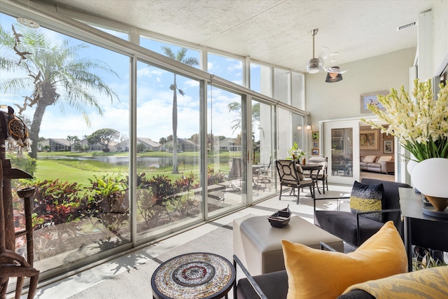 sunroom with a water view and visible vents