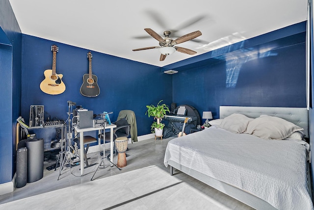 tiled bedroom featuring ceiling fan and baseboards