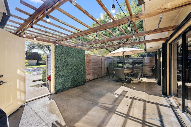 view of patio / terrace with outdoor dining space and a pergola