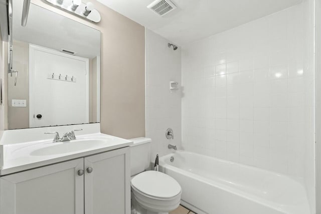 full bathroom featuring toilet, vanity, visible vents, and shower / bathtub combination