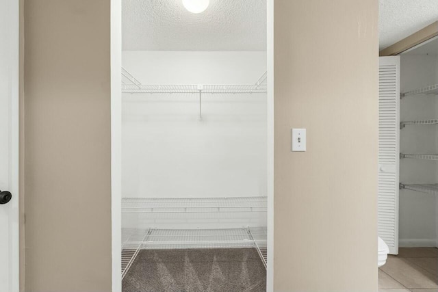 walk in closet featuring tile patterned floors