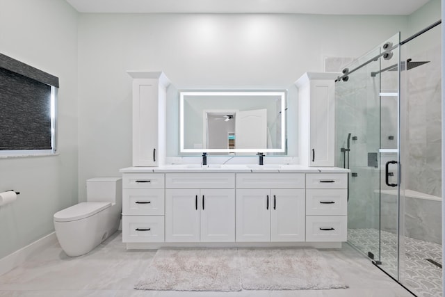 bathroom featuring a stall shower, toilet, and vanity