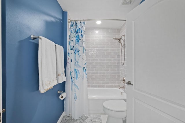 bathroom with shower / bath combination with curtain, visible vents, and toilet