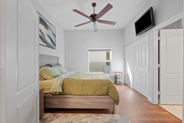 bedroom featuring a closet, ceiling fan, and wood finished floors