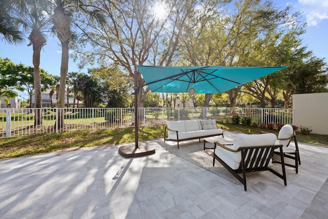 view of patio featuring fence and an outdoor living space