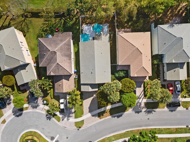 drone / aerial view featuring a residential view and a water view