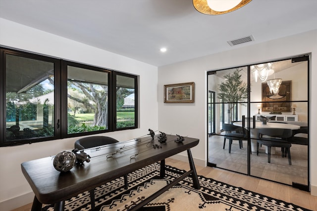 office area with baseboards, visible vents, wood finished floors, and recessed lighting