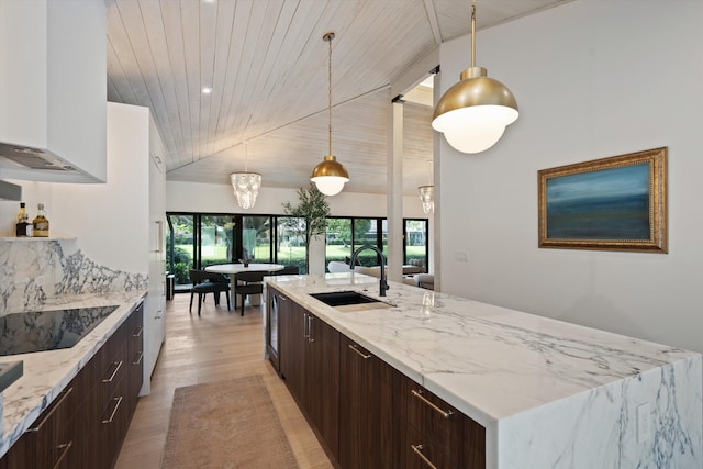 kitchen with wooden ceiling, black electric cooktop, light wood-type flooring, pendant lighting, and a sink