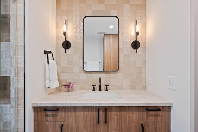 bathroom with backsplash and vanity