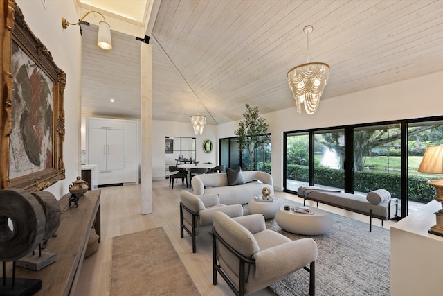 living room featuring wooden ceiling, light wood-style floors, a chandelier, and high vaulted ceiling