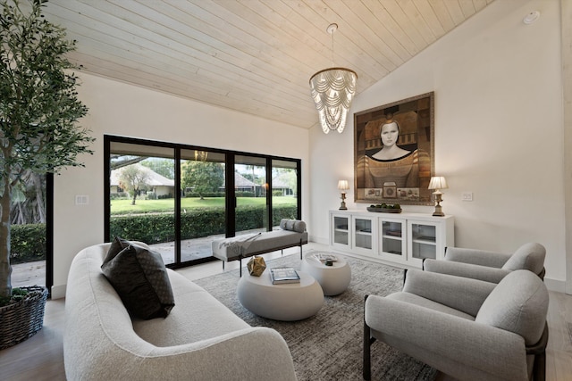 living area with a chandelier, wooden ceiling, high vaulted ceiling, and wood finished floors