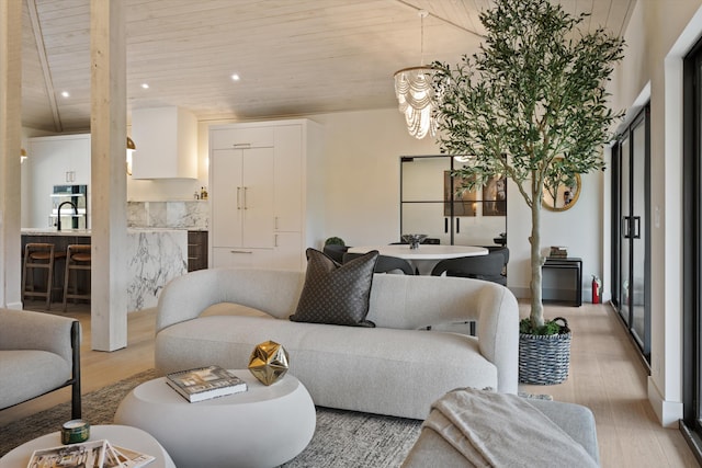 living area featuring recessed lighting, wooden ceiling, and light wood-style flooring