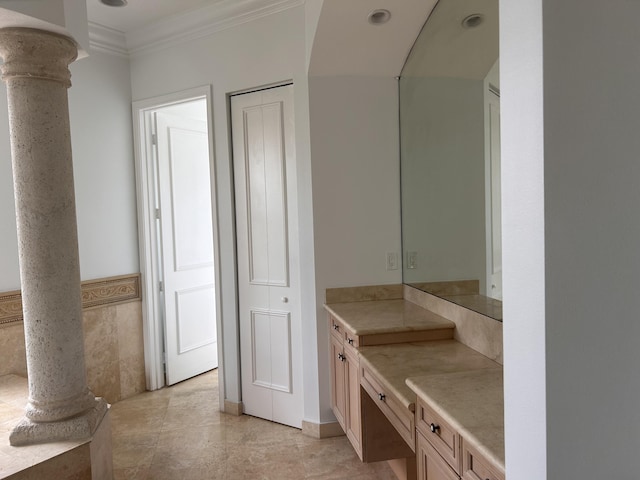 bathroom with ornamental molding, a closet, vanity, and ornate columns