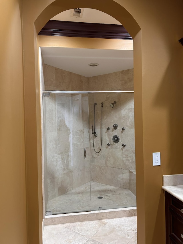 full bath featuring a stall shower and vanity