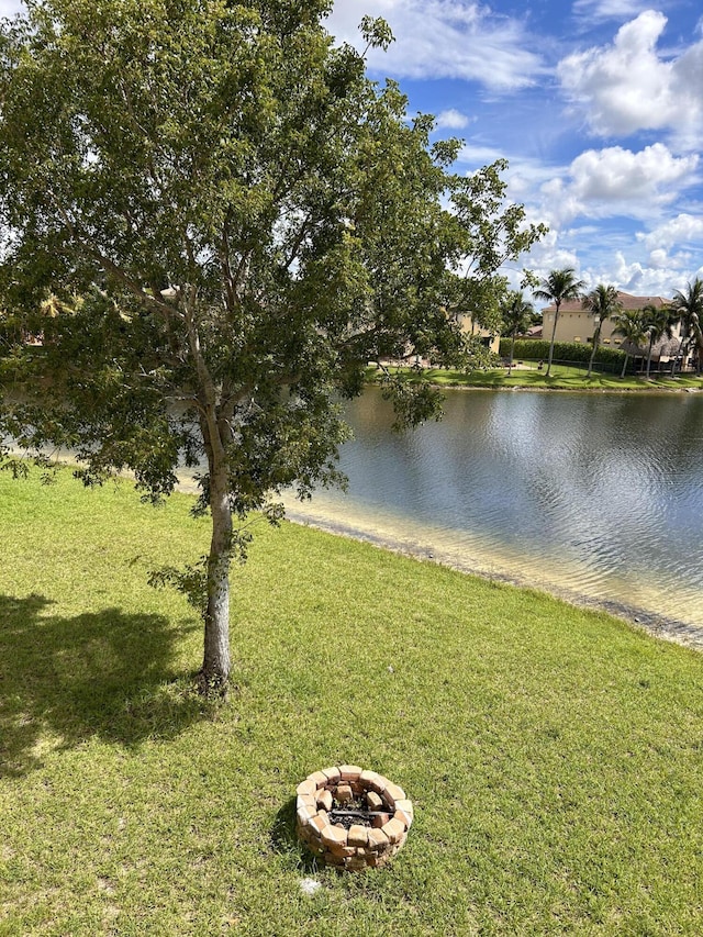 view of water feature with an outdoor fire pit