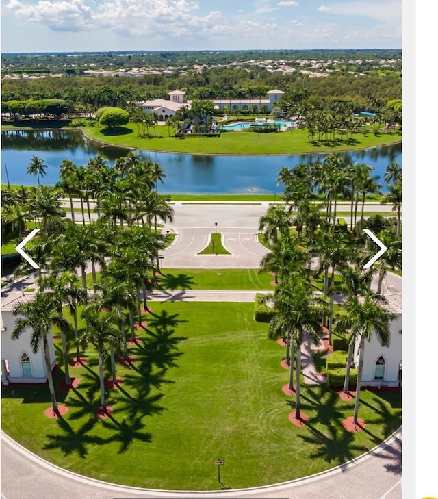 birds eye view of property with a water view