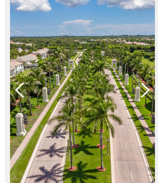 birds eye view of property with a residential view